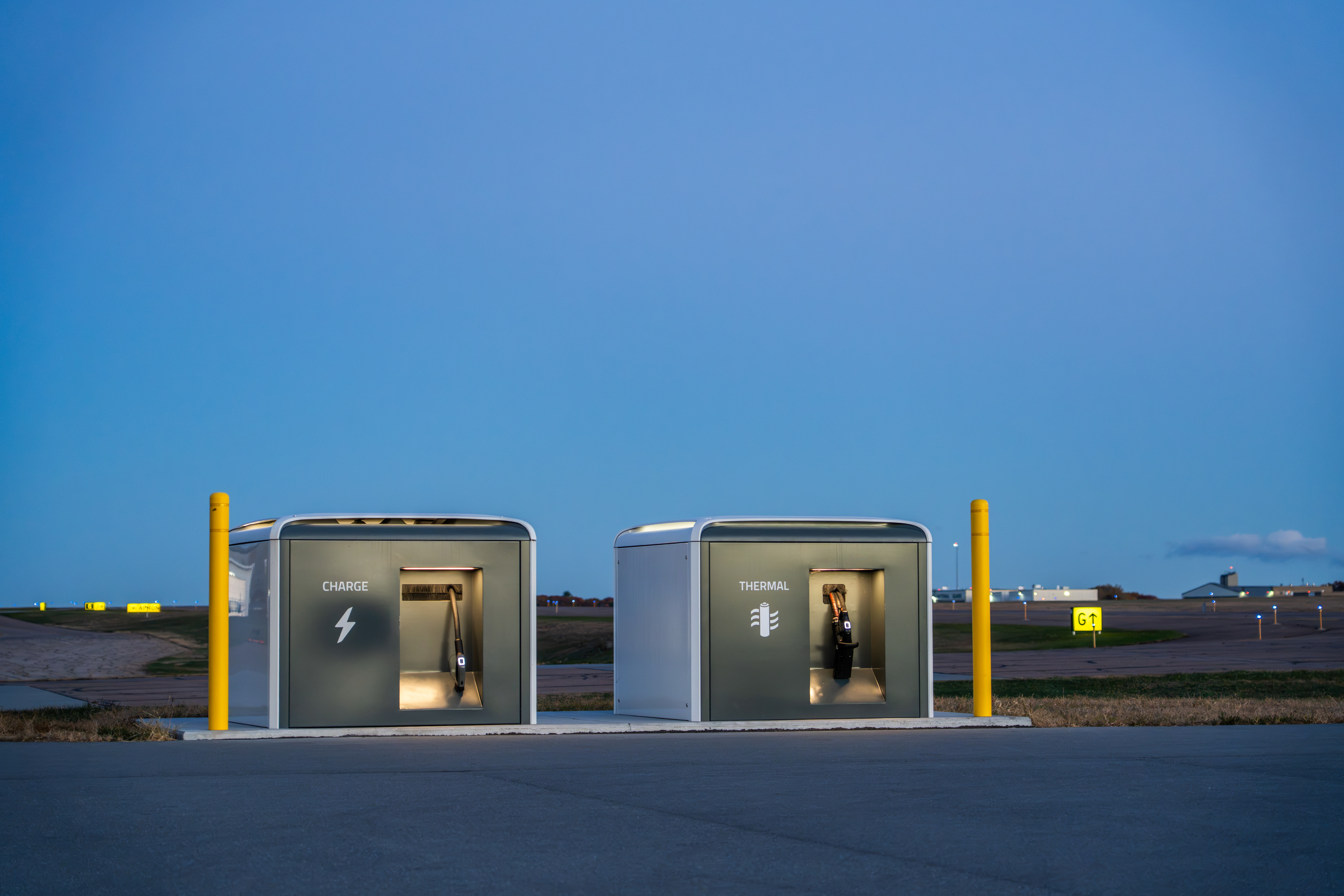 BETA Charge and TMS Cubes installed at an airport at dusk.