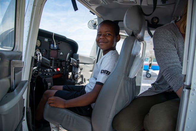 A potential future pilot sits in the cockpit at the kickoff event for FLIGHT VT on Saturday, June 5.