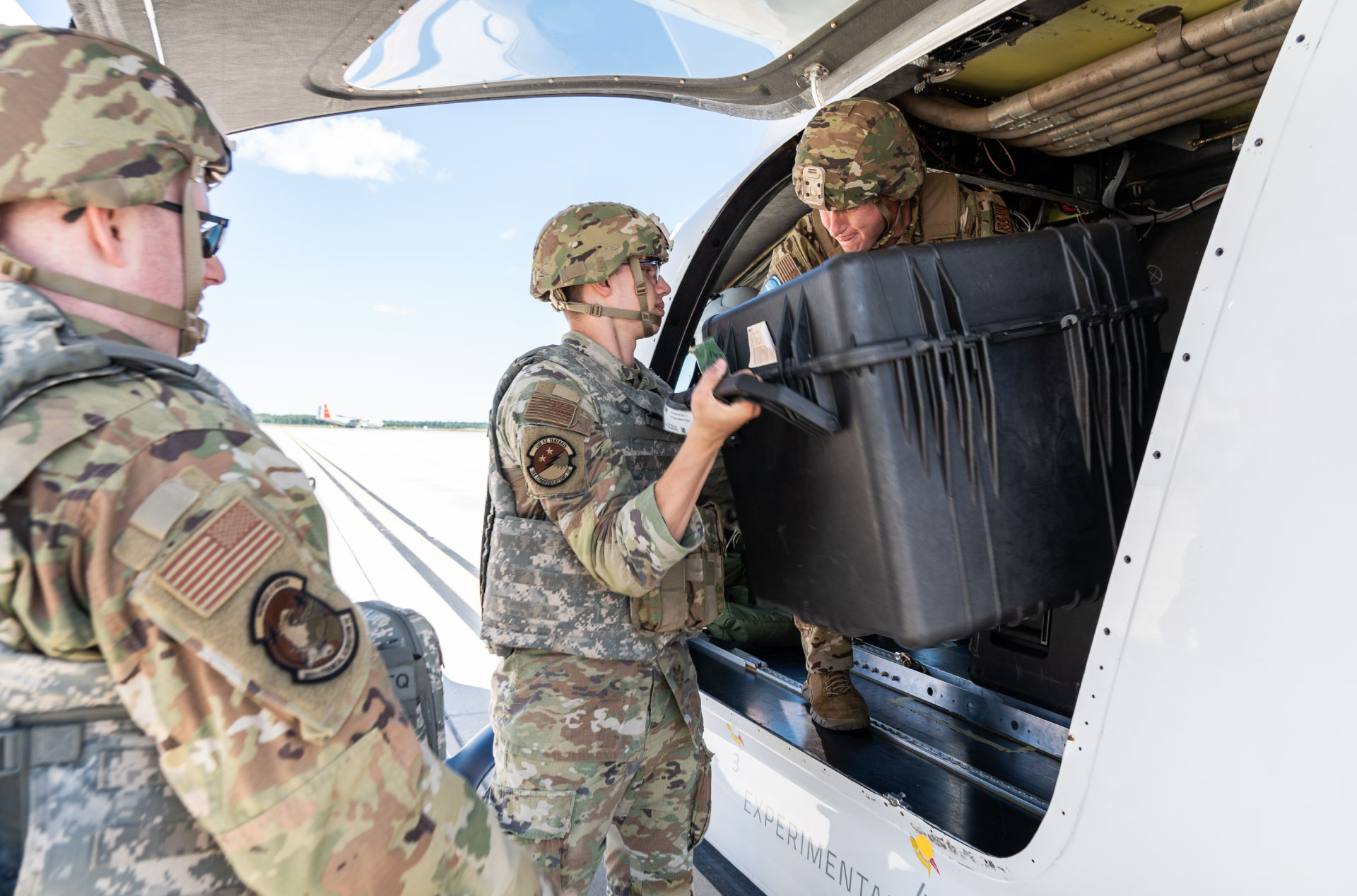 Military loading cargo onto BETA ALIA